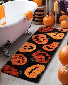 a halloween rug with pumpkins and jack - o'- lanterns on it