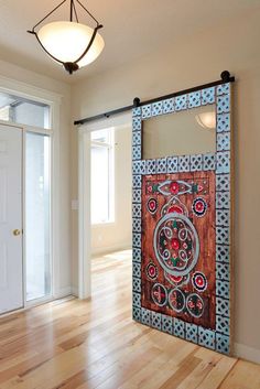 a room with wooden floors and a decorative door