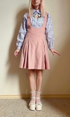 "Soft wool makes this suspender skirt a perfect winter piece. Fully lined (so you can wear with tights side zip, and buttoned straps. Back detail features gold oversized safety pins on the strap closure.  Flat measurements  Waist 13\" Overall length from shoulder 35\" Skirt length from waist 19\"" Childish Outfits For Women, Fitted Fall Pinafore Dress With Pockets, Fitted Knee-length Pinafore Dress For Fall, Knee-length Fitted Pinafore Dress For Fall, Fitted Pinafore Dress With Adjustable Straps, Overalls Skirt Outfit, 80s Skirt Outfit, Skirt Overalls Outfit, Pastel Academia Outfit