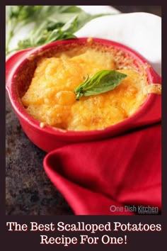 the best scalloped potatoes recipe for one is in a red bowl with a green leaf on top