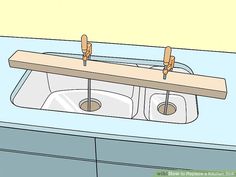 a kitchen sink with two rolls of toilet paper hanging from the faucet above it