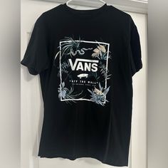 Basically New Without Tags. Washed Once And My Son Never Wore It . Size Medium Soft And Comfortable Cotton. Casual Vans T-shirt With Graphic Print, Vans Graphic Tee With Screen Print, Vans Graphic Print Crew Neck T-shirt, Vans Crew Neck T-shirt For Spring, Vans Graphic T-shirt For Streetwear, Vans Graphic Print T-shirt For Streetwear, Vans Graphic Print Tops, Vans Graphic Tee With Graphic Print, Vans Black Tops With Graphic Print