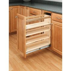 an open drawer in the middle of a kitchen