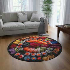 a living room with a white couch and large round rug on the floor in front of a window