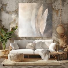 a living room with a white couch and large painting on the wall