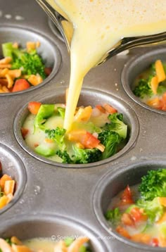 someone pouring dressing into a muffin tin filled with broccoli and carrots