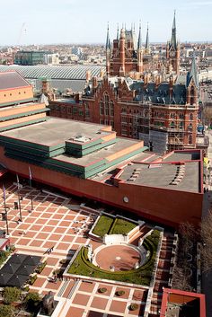 an aerial view of a large building in the city