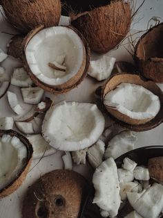 some coconuts are cut in half on a table