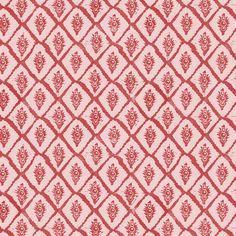 a red and white pattern on fabric