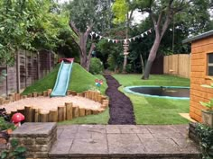 a backyard with a water slide in the middle