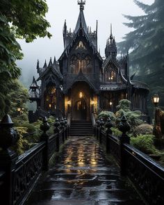 a gothic - style house is lit up in the rain