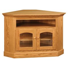 a wooden corner tv stand with glass doors on the front and bottom shelves in light wood