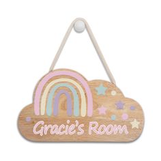 a wooden sign that says grace's room with a rainbow and stars on it