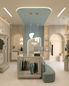 the interior of a clothing store with clothes on racks and lights hanging from the ceiling