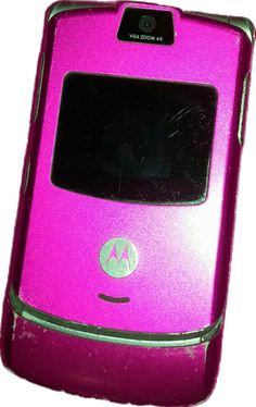 a pink motorola cell phone sitting on top of a white table