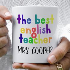 a person holding a coffee mug with the words'the best english teacher mrs cooper '