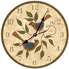 a clock with two birds sitting on top of it's face and numbers in the middle