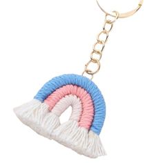 a keychain with a pink, blue and white object on it's side