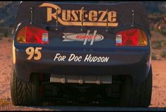 the back end of a race car with rust - eze on it