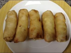 five fried food items on a white plate