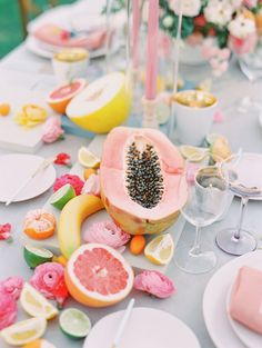 a table topped with lots of fruit and veggies