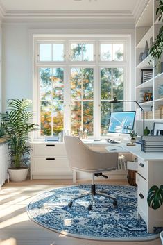 a home office with white walls and large windows