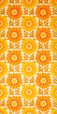 an orange and yellow flower pattern on fabric