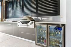 a kitchen with two refrigerators and a window