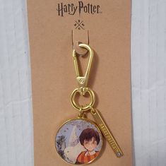 a harry potter keychain with a photo on it's front and back