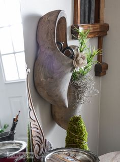 a potted plant sitting on top of a wooden shelf