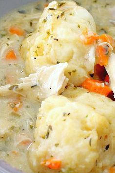 a bowl filled with chicken and dumpling soup