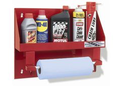 a red shelf with several different types of cleaners and other items on it,