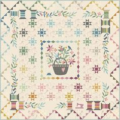 a quilt with flowers in a pot on the front and bottom, surrounded by stars