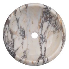 a marble sink that is white and brown