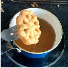 a bowl filled with soup and a spoon in it