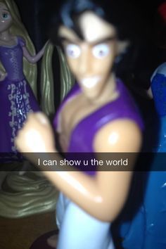 there is a figurine that says i can show u the world