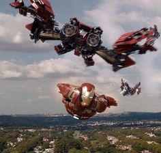 an image of some cars flying in the air with iron man on it's back