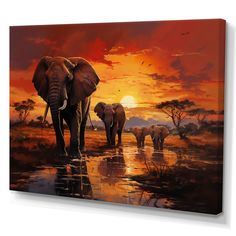 three elephants are walking through the water at sunset