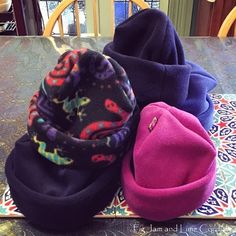 three hats sitting on top of a table