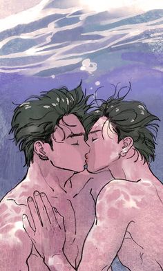 two people kissing under the water with their heads close to each other's chest