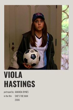 a woman holding a soccer ball in her hands and wearing a hat with the words viola hastings on it