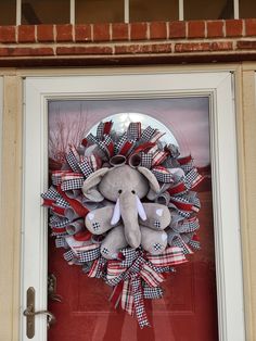 an elephant wreath on the front door of a house