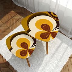 two chairs sitting on top of a white rug