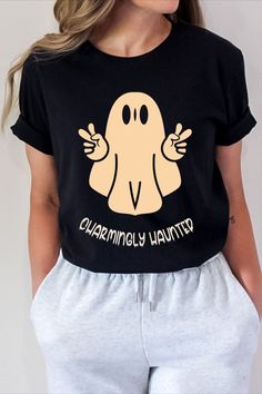 Black shirt with 'charmingly haunted' print on it Ghost Sweatshirt, The Supernatural, Breezy Dress, Ghost Shirt, Halloween Fashion, Halloween Tees, Lightweight Tops, Cozy Sweatshirts, Cute Ghost