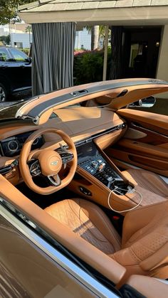 the interior of a luxury car parked in front of a building