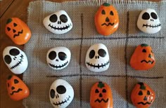 pumpkins and jack - o'- lanterns are arranged in the shape of skulls