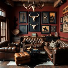 a living room with leather furniture and pictures on the wall