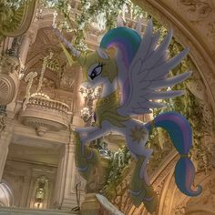 an animated unicorn flying in the air above a building with columns and ceiling lights on either side