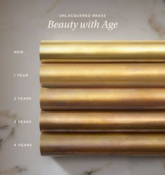 an image of some gold foil on a marble counter top with the words beauty with age written below it