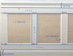 the measurements for an unfinished window frame with blue tape on it and white trim around the edges